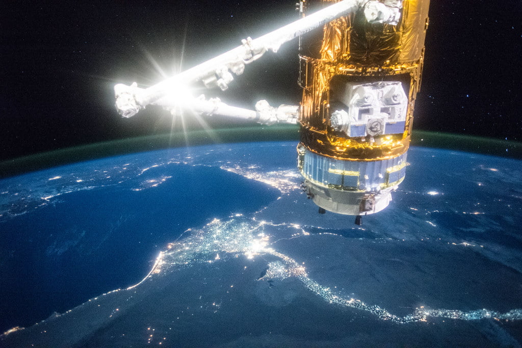 Japan's HTV-5 cargo craft is illuminated with the Nile river below georgefeola.io marketing to the world