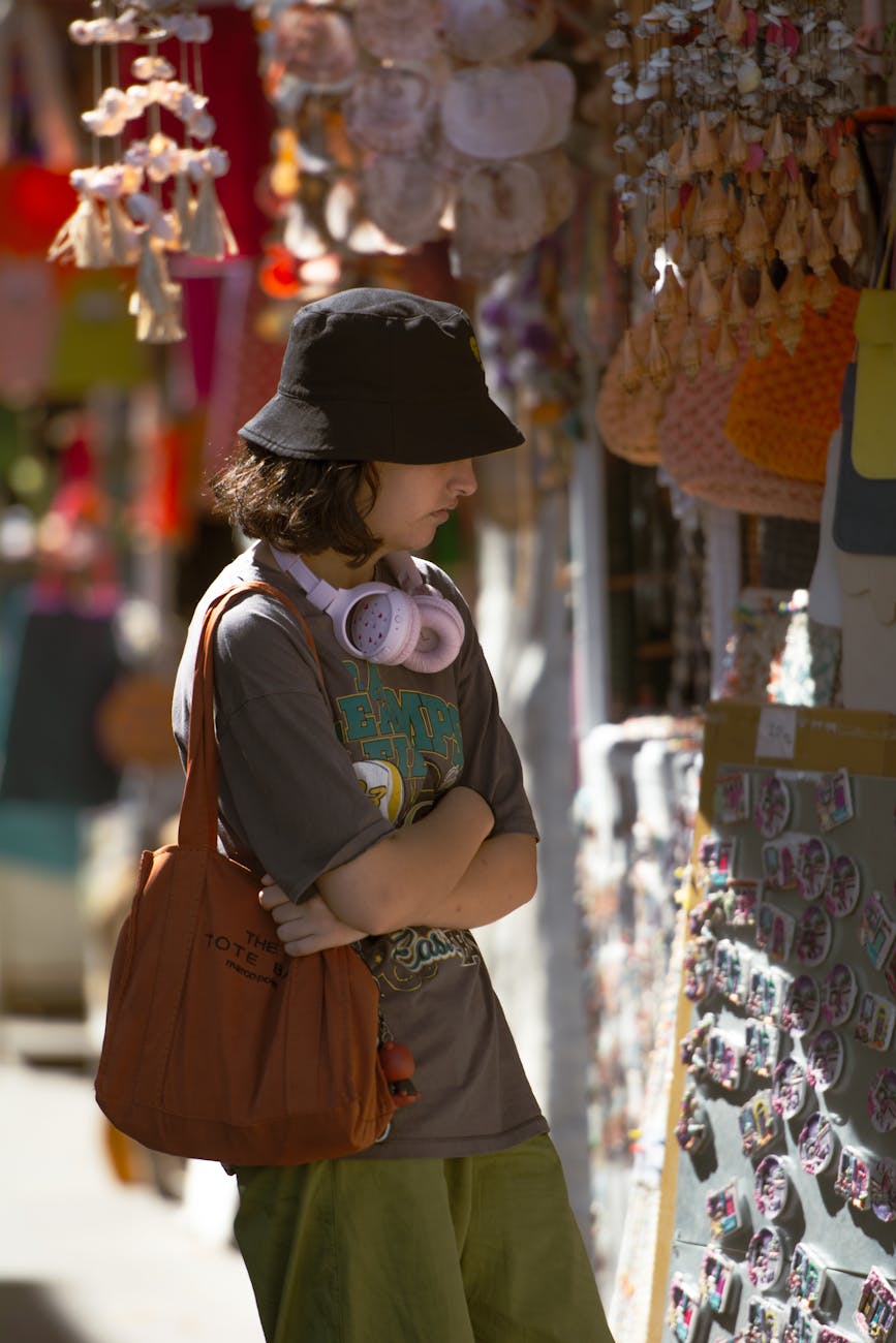teenager by display of souvenirs