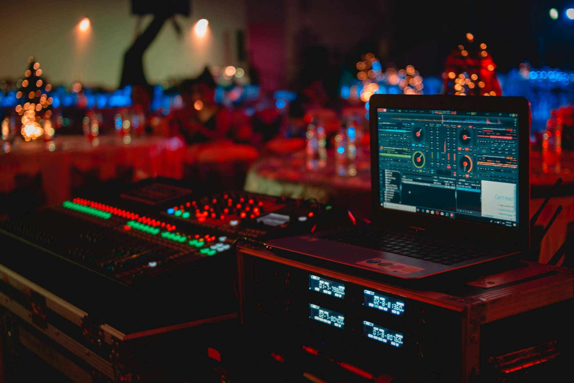black laptop beside audio mixer set. georgefeola.io george feola tech