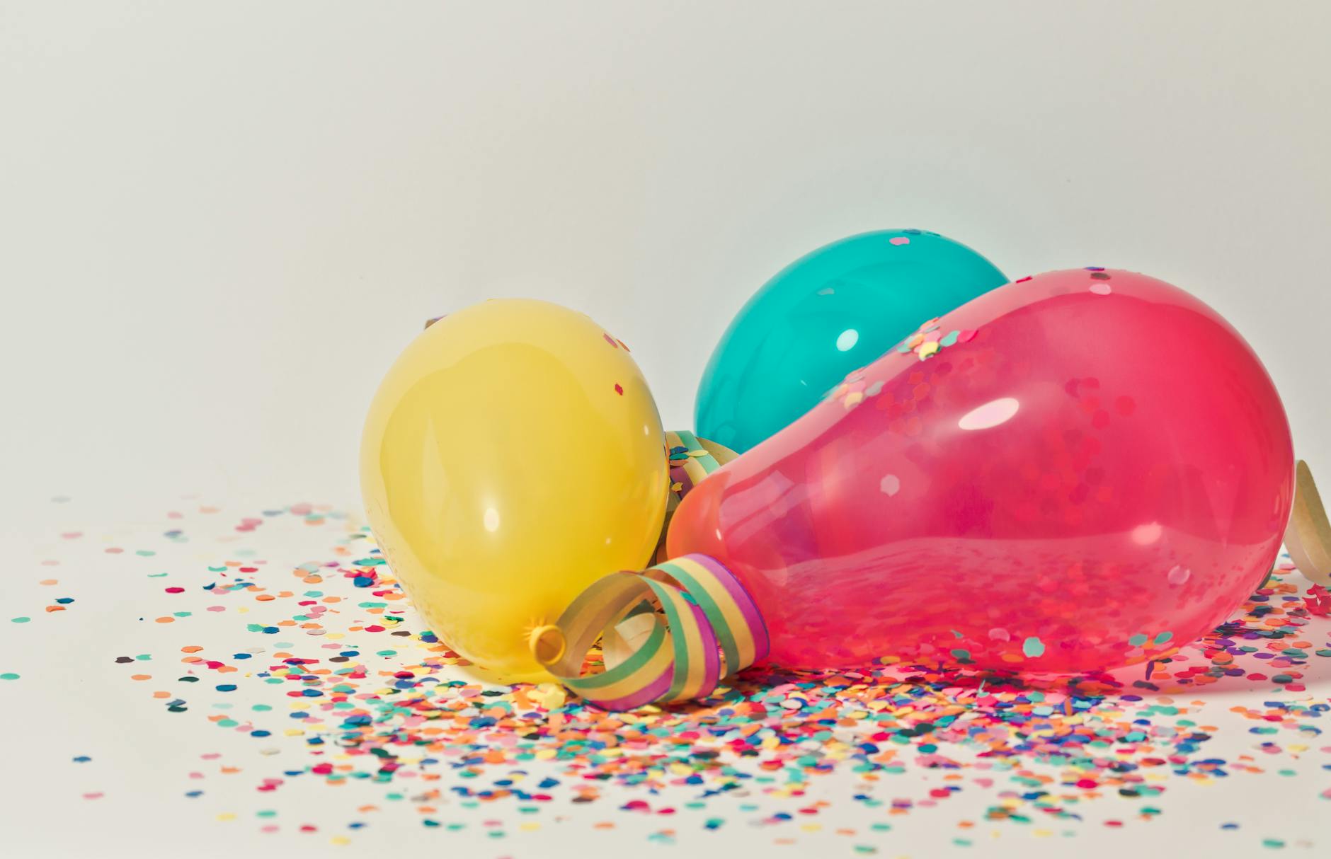 colorful balloons with confetti georgefeola.io george feola