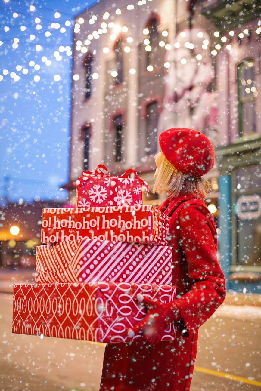 woman holding three red christmas presents boxes. Holiday shopping. social media marketing. george feola