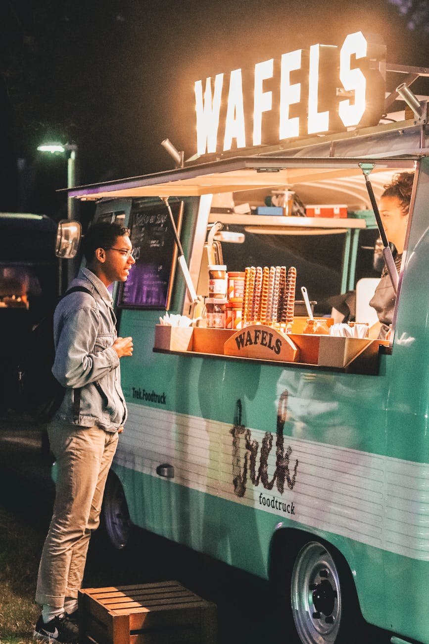 man standing near food truck