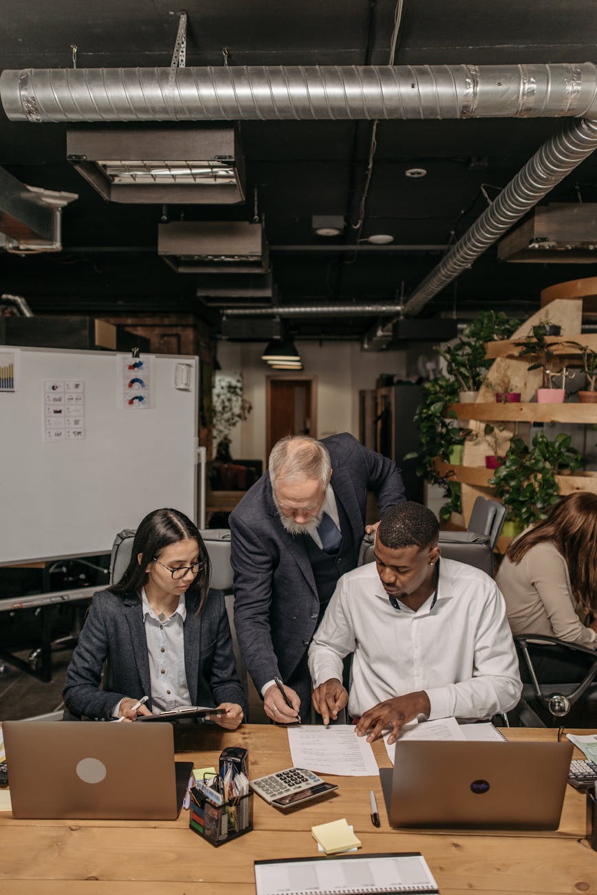 four people working in the office
